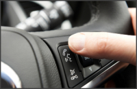 Hand ready to answer a call via bluetooth in car