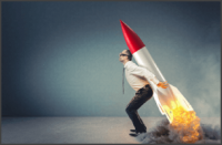 Man holding a rocket on his back ready to launch