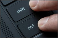 Fingers holding down Shift and Ctrl keys