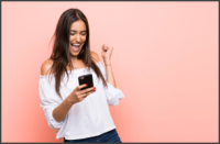 Happy woman looking at her phone