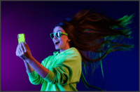 Amazed woman looking her phone